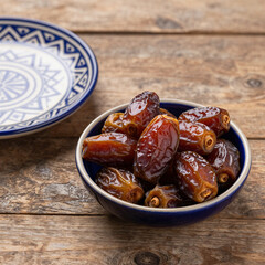 Bowl of dates for Ramadan on a wooden table