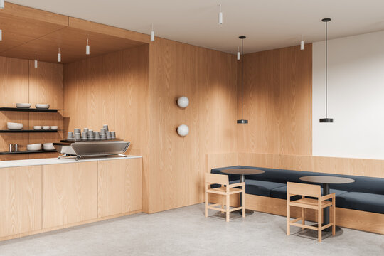 Minimalist modern cafe interior design with wooden walls, concrete floor, espresso machine and seating area featuring round tables and chairs. 3D Rendering