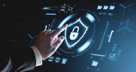 Cybersecurity user interface concept with digital padlock icon and businessman hand interacting on futuristic HUD system background screen.
