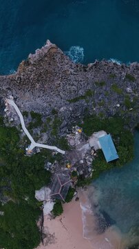 Aerial Drone View Path Leading To Balines temple, Stone Walkway Branches Into,Nusa Dua, Bali,Indonesia,Vertical video