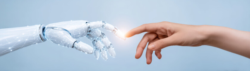 Human hand and robotic hand reaching to touch with glowing connection, symbolizing technology and human interaction in futuristic concept