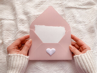 Pink envelope and greeting card. Valentine`s Day aesthetic