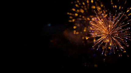 Golden fireworks on black background with bokeh effect, horizontal banner, free space for text, Independence Day
