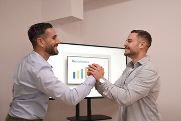 Business partners celebrating achieving results and success