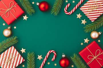 Christmas gifts and decorations on green background