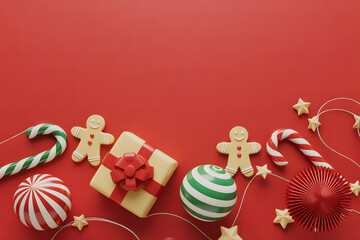 Festive red background with gingerbread cookies candy canes and holiday decorations