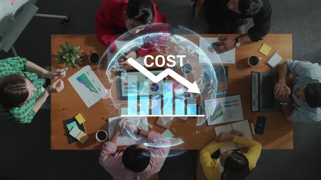 A diverse team collaborates over a wooden table, analyzing global cost trends through charts and graphs in a modern office environment, highlighting teamwork. Raster