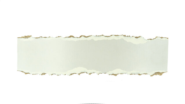Torn paper strip with rough, uneven edges revealing a brown kraft paper texture beneath. Concept for design elements and creative backgrounds