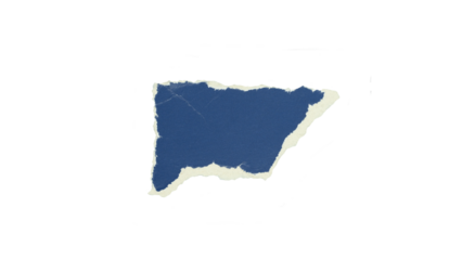 Small torn piece of deep blue paper with irregular edges revealing white fiber texture beneath. Concept for artistic collage and abstract composition