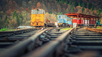 view to vintage locomotives from low point on rails
