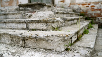 Decaying stone steps of abandoned building