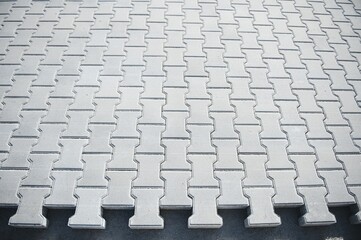 Fototapeta premium Laying paving slabs. Gray stone blocks for laying park paths