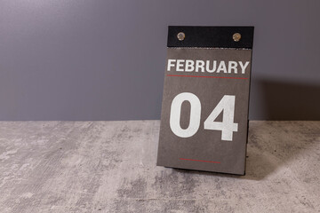Save the Date written on a calendar - February 04.