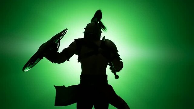 Silhouette of a Spartan Warrior with Sword and Shield on a Green Background.