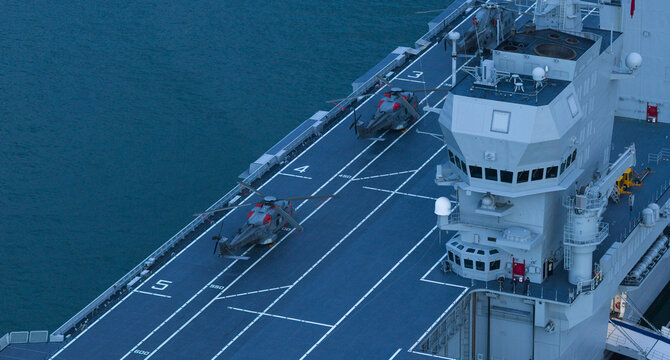 Aerial view of helicopters poised on the flight deck of the LHD Trieste, against the backdrop of the Adriatic Sea, Trieste, Italy.