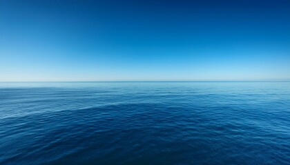 calm pacific ocean water reflecting a clear blue sky creating a serene and vast minimalist seascape
