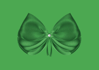 A large green bow on a green background