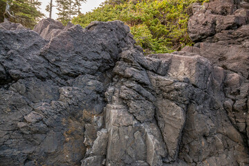 Rugged Black Rock Cliff Face Along the West Coast Shore in Tofino, Vancouver Island
