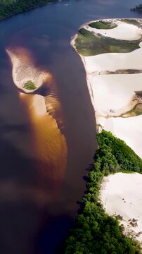 Mandacaru Island In Lencois Maranhenses Maranhao Brazil. Aerial View Of A River Surrounded By Lush Green Tropical Rainforest. Coast Clouds Seaside Summertime. Outside Seaside Panoramic.