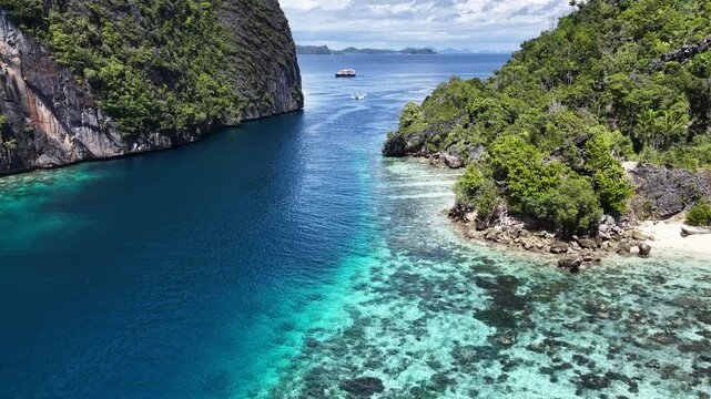 Water flows through a narrow channel in Misool, Raja Ampat. This area harbors spectacular marine biodiversity and is a popular area for diving and snorkeling,