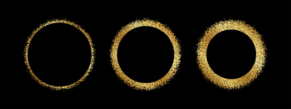 Set of golden round frames with grainy texture. Gold circular shapes with glitter, scatter or mezzotint effect borders isolated on black background. Solar eclipse silhouettes. Vector illustration.