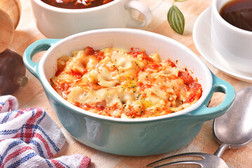 Margherita farfalle gratin in a baking dish . 