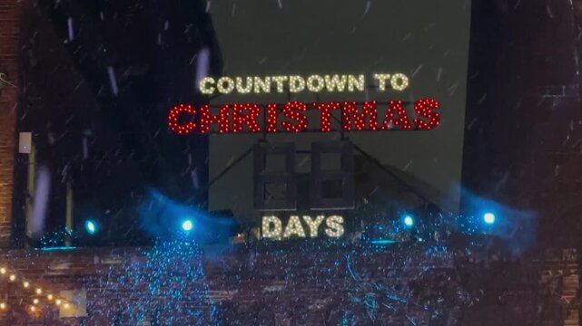 Countdown sign in the Distillery District, Toronto, Canada. Snow falling in the famous place