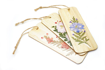 Handmade Bamboo Bookmark with Pressed Flowers isolate on white background. DIY bookmark
