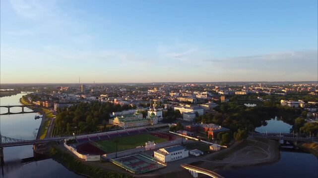 Drone flies over the Volga River in Tver. Aerial views show the city, bridges across the river, a cathedral, the river embankment, and other landmarks from above.
