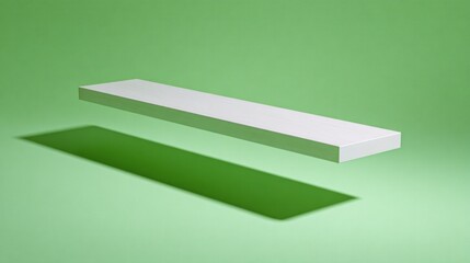 Minimalist white rectangular slab floats above a vibrant green surface casting a long shadow