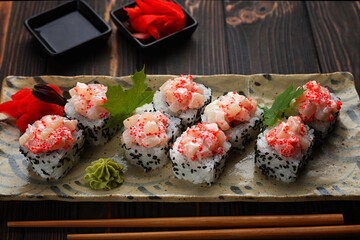 Sushi Rolls On Wooden Background © pobaralia