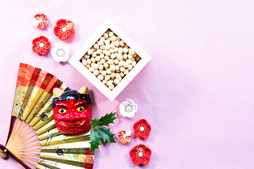 ピンク背景の節分デザイン