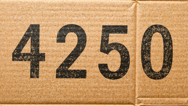Large Black Numbers on Brown Cardboard Box