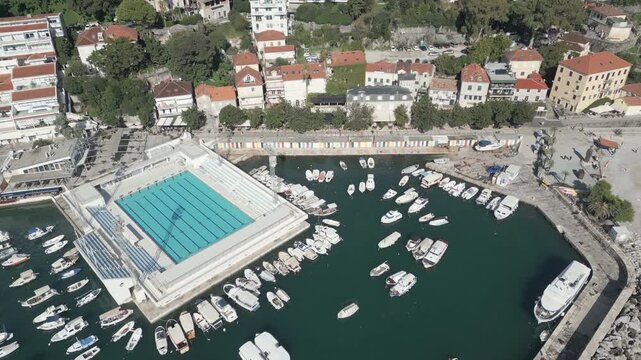 Aerial perspective of a sea marine in Herceg Novi, Crna Gora. Flying forwards.