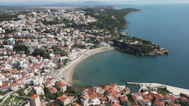 A drone easy rotates and captures a scenic view of Ulcinj, a coastal Adriatic town located in the south of Crna Gora.