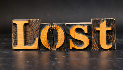 Vintage Wooden Letter Blocks Spelling "Lost"