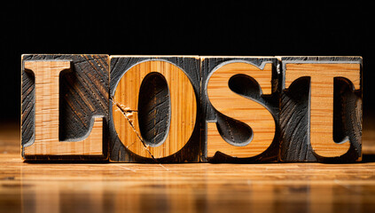 Vintage Wooden Letter Blocks Spelling "Lost"