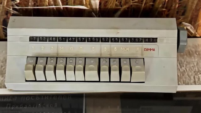 An Old Mechanical Adding Machine With Numbered Dials and Rows of Levers - Zoom In Shot