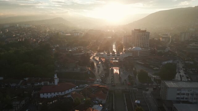 Silhouette sunset panorama of Novi Pazar, Serbia, captured by a drone. Aerial footage.