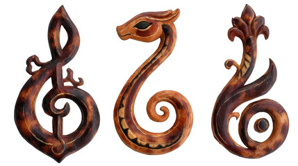 Three intricately carved wooden symbols featuring a musical note, a serpent, and a floral design