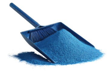 Blue dustpan filled and spilling with bright blue grainy powder