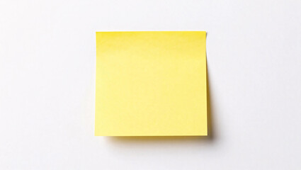 A single, blank yellow sticky note sits centered on a clean white background, casting a soft shadow that adds depth to the minimalist composition.