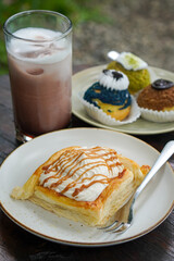 Sweet assorted pastries with colorful cream puffs, soft airy texture, creamy rich filling, and delightful dessert flavor, modern caf&eacute; style presentation with inviting visuals and appetizing charm