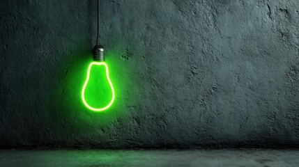 Green neon bulb hangs against a textured gray wall in moody lighting