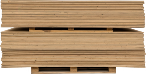 Two large stacks of thin wooden boards likely plywood or particle board are neatly piled on wooden pallets under a studio light They are positioned one above the other material construction