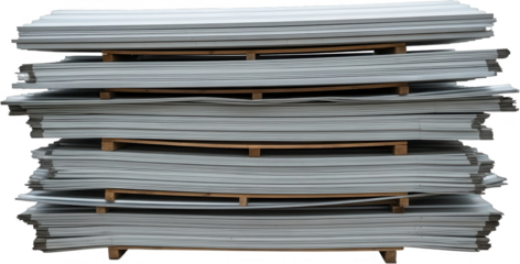 A tall stack of flat grey corrugated metal sheets is neatly organized on wooden pallets in an industrial setting material construction building raw metalwork roofing siding sheet metal