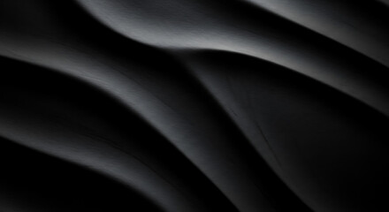 Dark undulating waves of textured black with subtle light reflections abstract