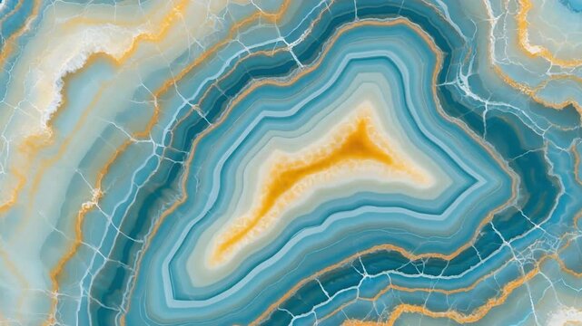 A close-up view of a polished agate slice revealing intricate layers of blue, teal, and golden yellow hues with delicate white veining.