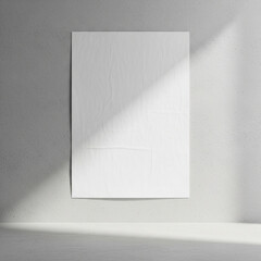 Mockup of a blank poster mounted on a light concrete wall, modern studio environment, soft diffused daylight from the side