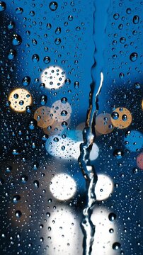 raindrops falling down a window